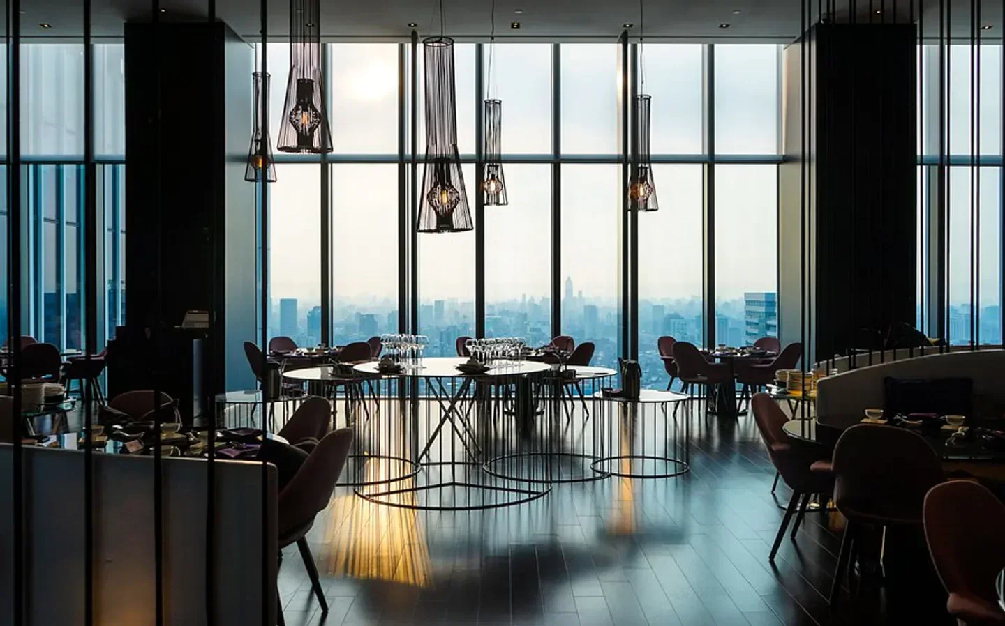 Elegant interior of YEN Taipei restaurant with city views in Taipei.