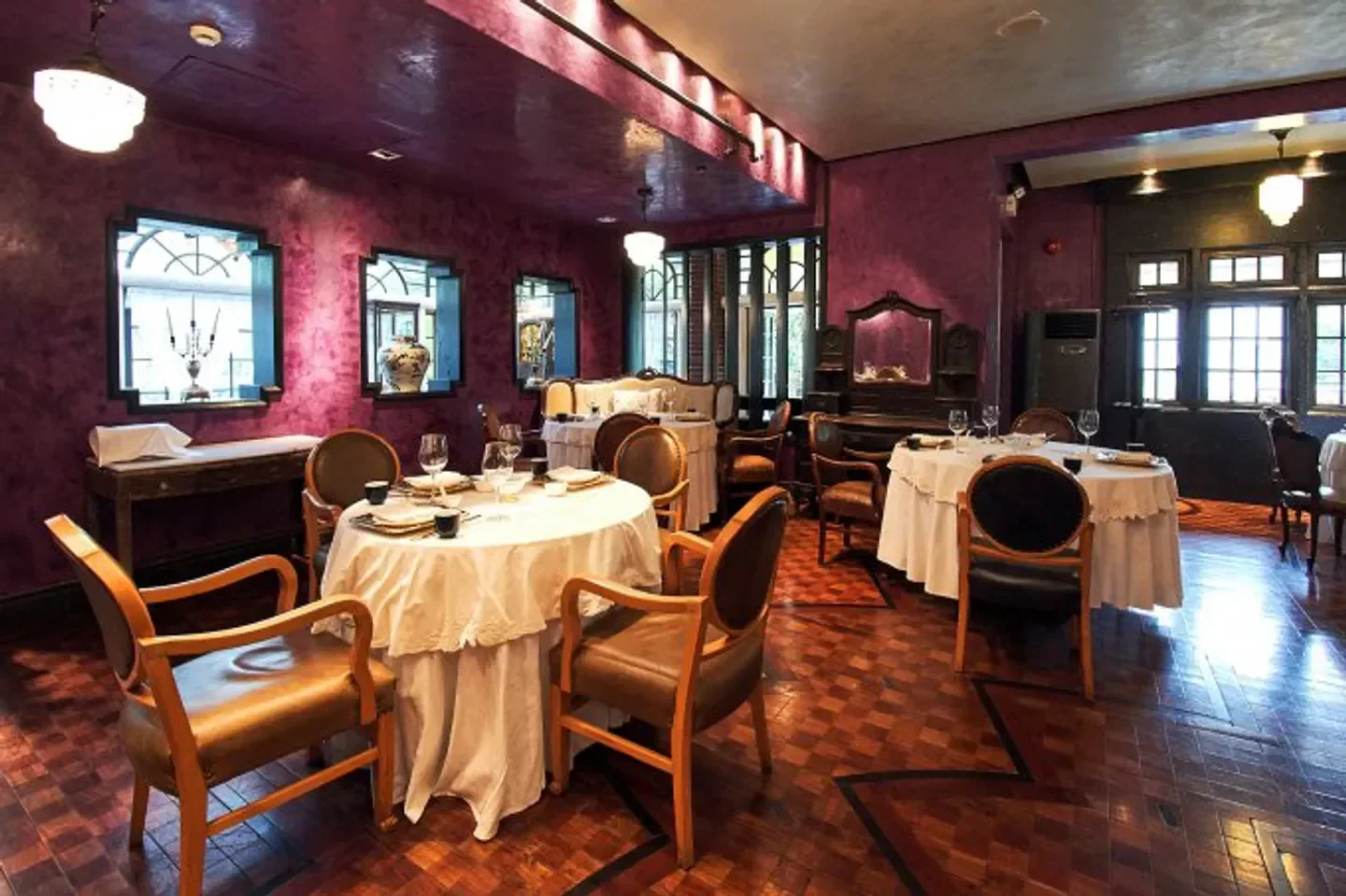 Elegant interior of YongFoo Élite restaurant in Shanghai, with tables set for dining.