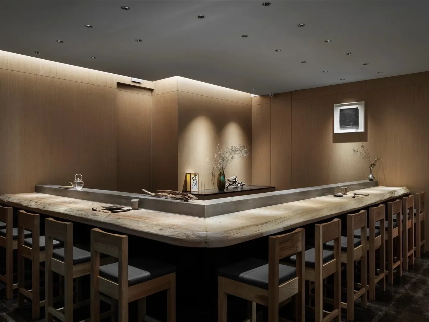 Interior of Yu Kapo restaurant in Taipei with a wooden bar and seating.