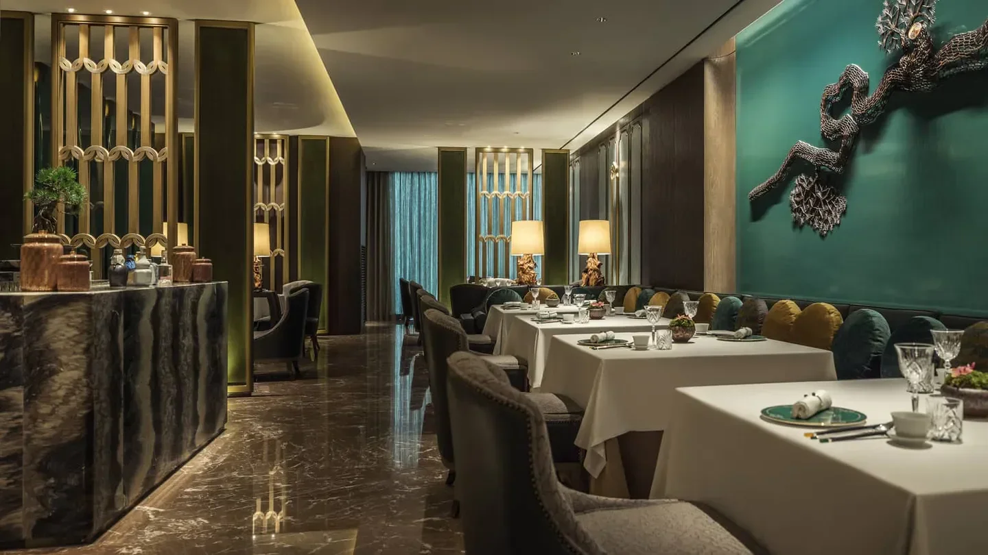 Elegant interior of Yu Yuan restaurant in Seoul, showcasing stylish dining tables and decor