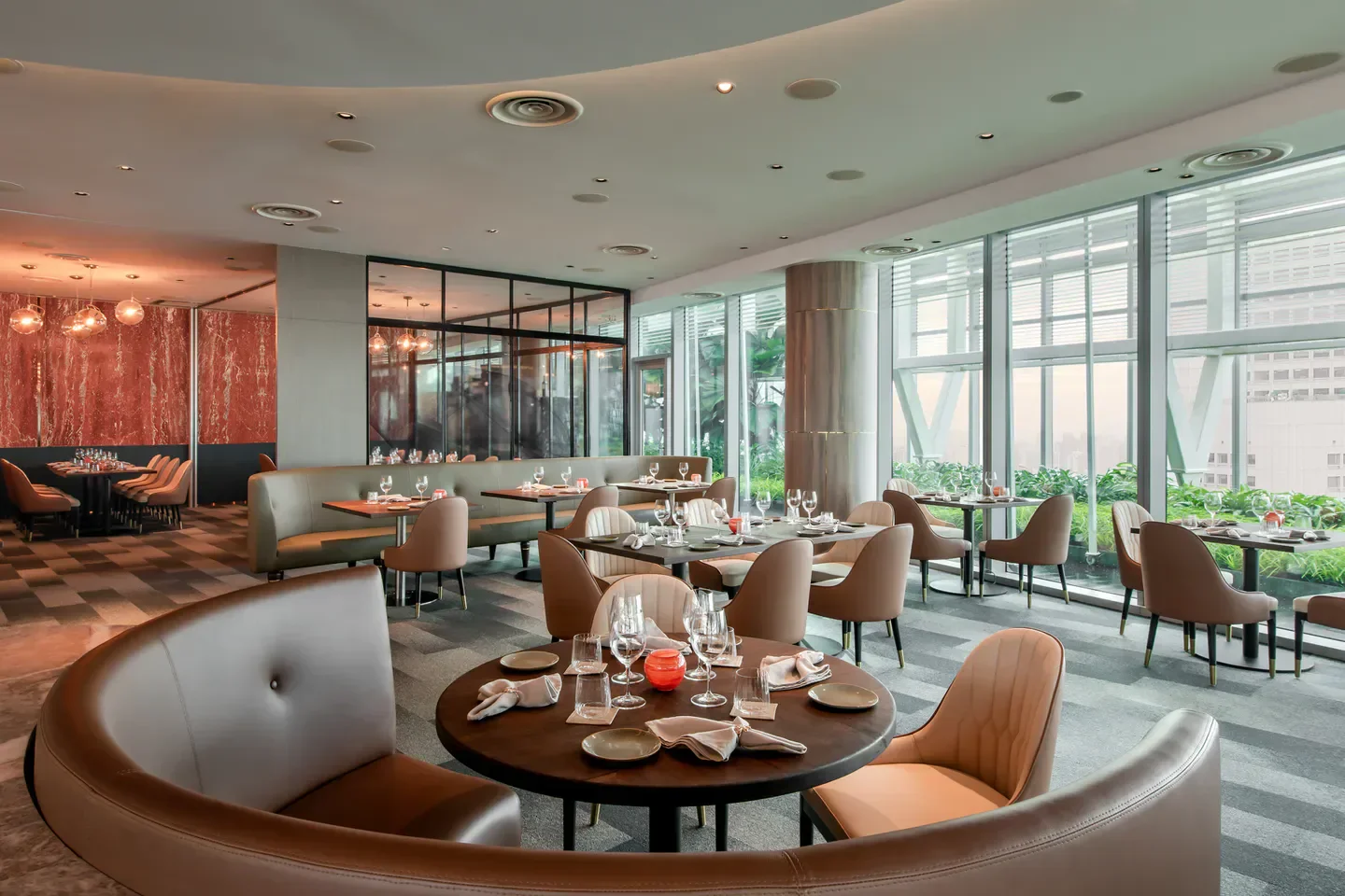 Elegant interior of Zafferano restaurant in Singapore, featuring stylish seating and city views.