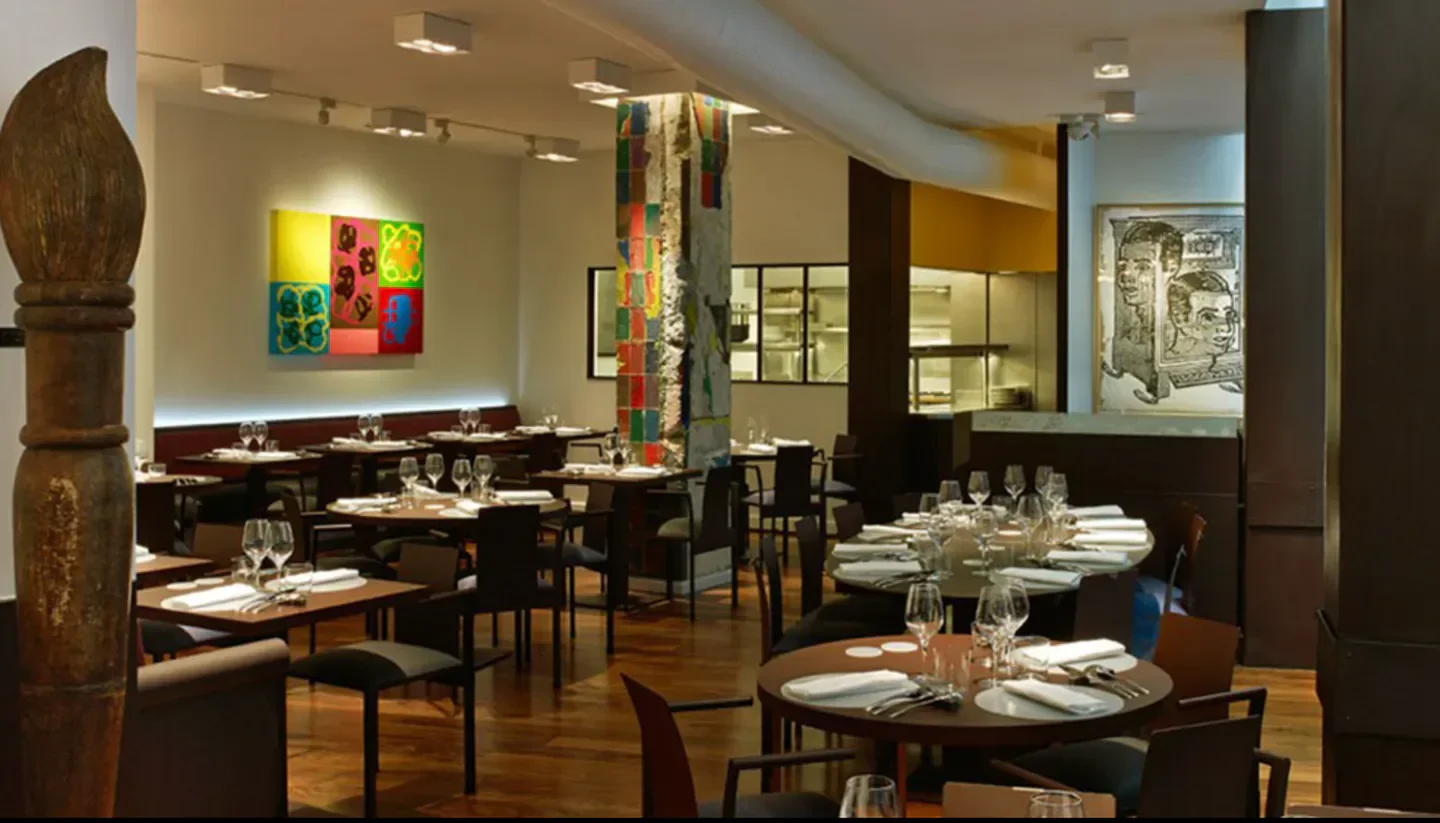 Interior of Ze Kitchen Galerie in Paris, featuring modern decor and dining tables.