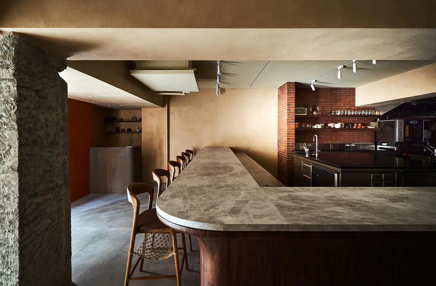 Interior of ZEA restaurant in Taipei, featuring a stylish bar and kitchen area.
