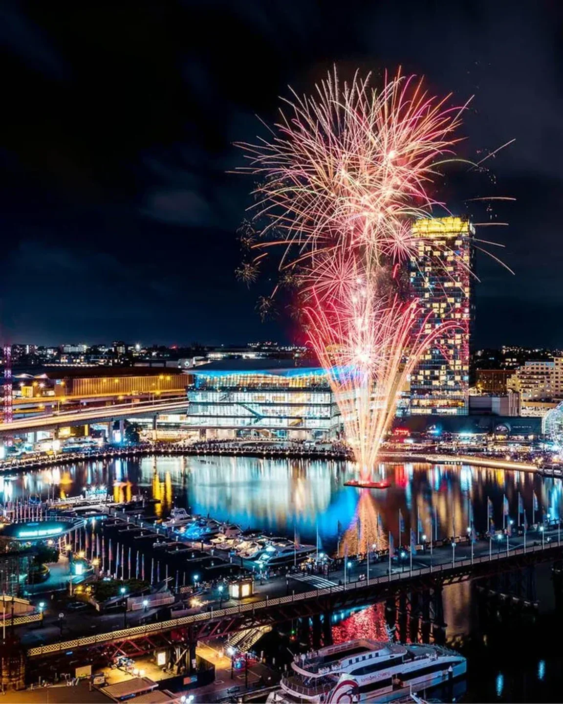 Spectacular fireworks display over Darling Harbour, viewed from Zephyr Bar in Sydney, Australia.