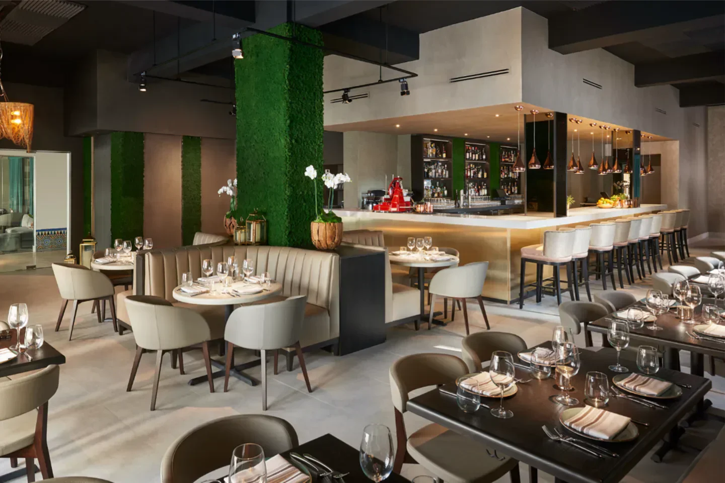 Stylish interior of Zucca Miami restaurant with elegant bar and dining tables