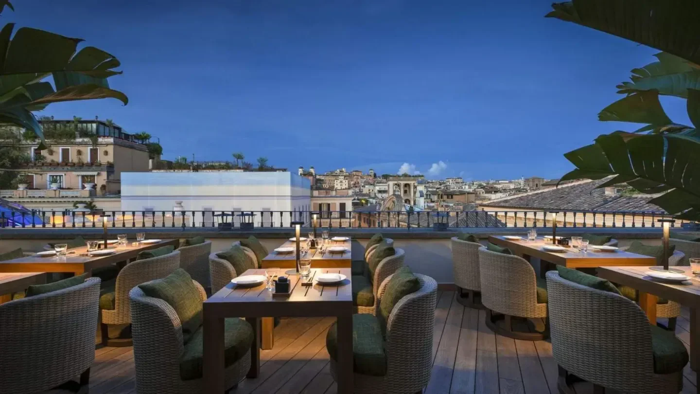 Rooftop dining at Zuma Rome, with city views and elegant tables at dusk